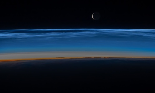 Noctilucent clouds hovering over Earth