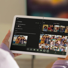 A person holding a Google Pixel tablet.