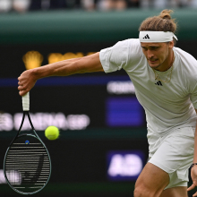 Zverev returns the ball