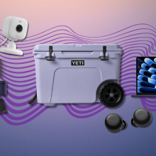 Dyson Airwrap with accessories, Blink Mini 2, Yeti cooler, MacBook Air, and Echo Buds with colorful gradient background
