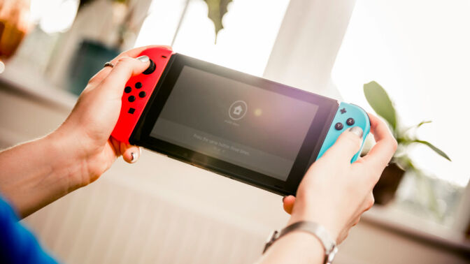 Nintendo Switch in person's hands