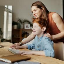 Mother and child using PC