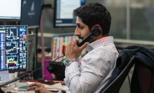 Rishi Ramdani takes a call at his desk.