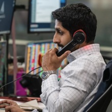 Rishi Ramdani takes a call at his desk.