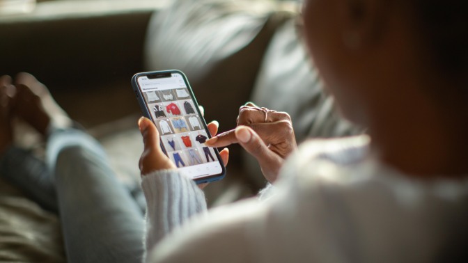 Woman purchasing clothes on a mobile app