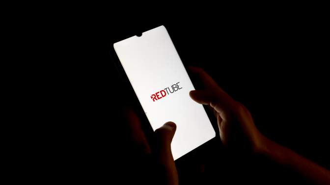 In this photo illustration a Redtube logo seen displayed on a smartphone screen