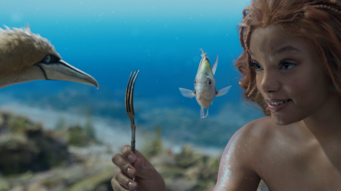 still from 'The Little Mermaid' of Halle Bailey as Ariel, with Scuttle and Flounder