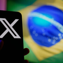 The Brazilian flag is seen reflected on a phone screen with the X logo in this illustration photo taken in Warsaw, Poland on 01 Septemnber, 2024.