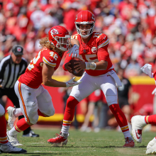 Patrick Mahomes of the Kansas City Chiefs fakes a handoff