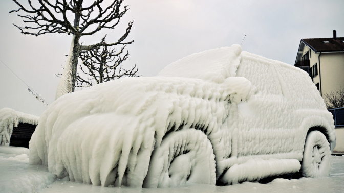 A car frozen over with ice.