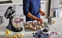 A person makes cupcakes with the KitchenAid mixer