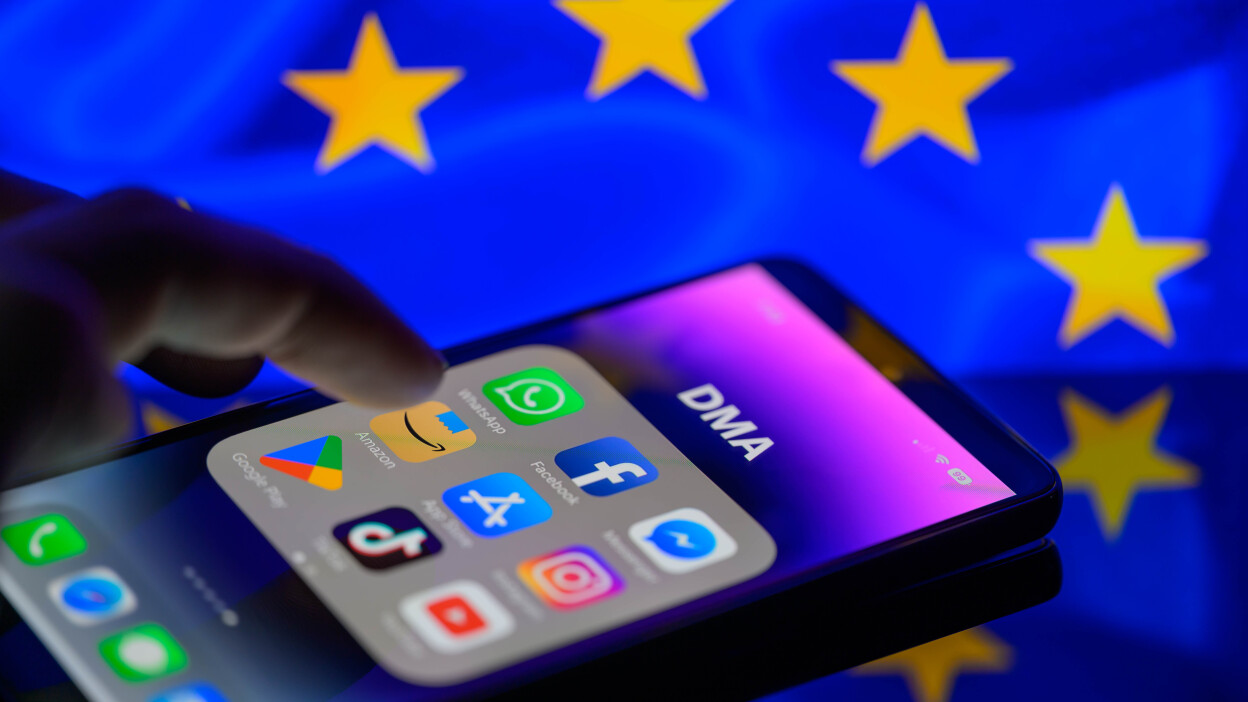 iPhone with apps, EU flag in the background