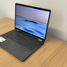 An HP Chromebook sitting on a wooden table