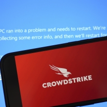 CrowdStrike logo over the Microsoft Windows blue screen of death