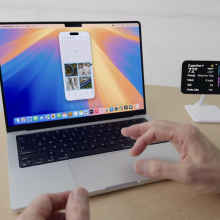 a Mac with an iPhone mirrored on its screen