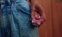 Girl holding Bitty Boomer 'Stranger Things' Demogorgon speaker