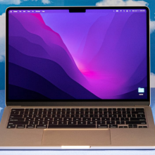 the 13-inch m2 apple macbook air against a cloud-patterned background