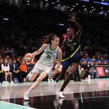 Breanna Stewart #30 of the New York Liberty in action against Awak Kuier #28 of the Dallas Wings