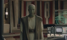 Vernestra Rwoh, a bald, green humanoid alien, in the Jedi Temple.