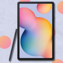 Samsung Galaxy Tab S6 Lite with S Pen on light blue background with orange dots