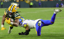 Aaron Jones of the Green Bay Packers avoids a tackle 