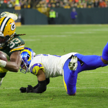 Aaron Jones of the Green Bay Packers avoids a tackle 