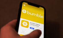 Bumble dating app logo on the App Store is seen displayed on a phone screen