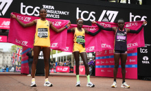 Second placed Tigst Assefa of Ethipoia, first placed Peres Jepchirchir of Kenya and third placed Joyciline Jepkosgei of Kenya celebrate winning the Women's elite race at London 2024