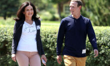 Image of Sheryl Sandberg and Mark Zuckerberg walking