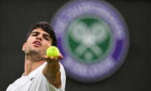 Alcaraz serves at Wimbledon