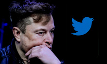 Elon Musk looking pensive next to a Twitter icon