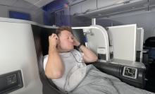 A man sitting in first class on an airplane