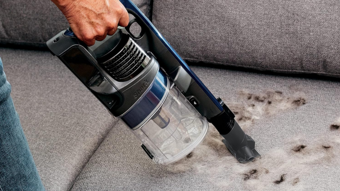 shark pet vacuum handheld cleaning a couch