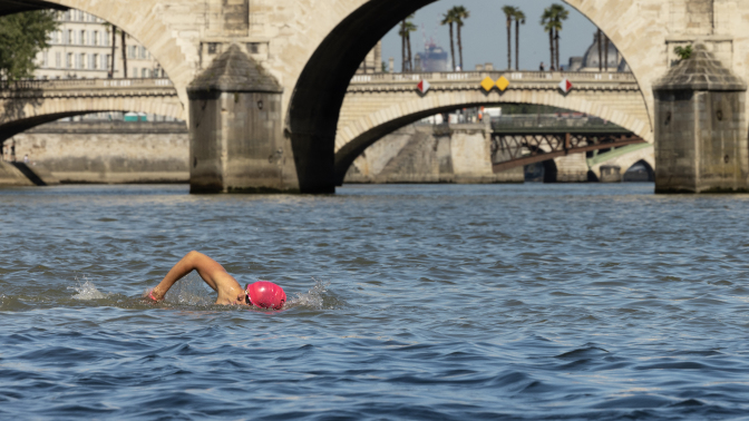A local resident swims in the Seine