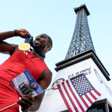 Noah Lyles celebrates with the gold medal