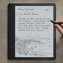 a right hand writes on the kindle scribe with the included pen