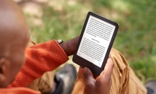 Person reading a Kindle er-eader tablet