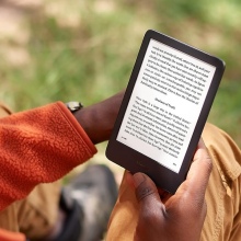 Person reading a Kindle er-eader tablet