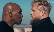 mike tyson and jake paul staring each other down