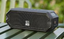 Small black speaker on a green table