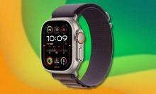 An Apple Watch Ultra model superimposed on a rainbow background