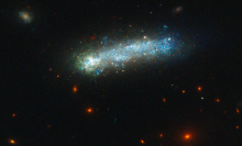 Distant galaxy puts on a fireworks show in new Hubble photo