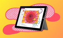 microsoft surface tablet with orange and pink background