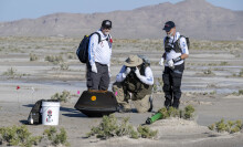 NASA team inspecting the asteroid capsule