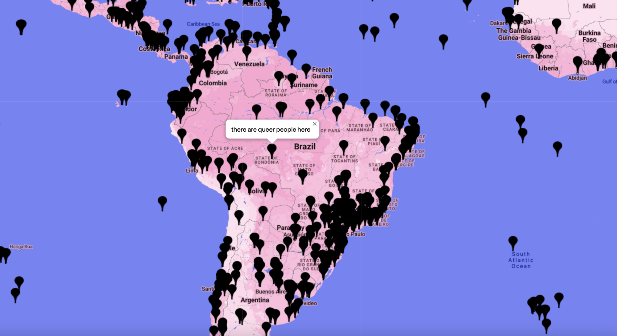 A screenshot of the Queering the Map website. A pop-up window in Brazil reads, "there are queer people here."