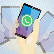 A graphic of phone screens with the WhatsApp logo in the middle.