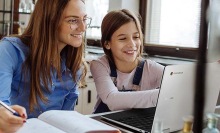 Two people using the Samsung Chromebook 4.