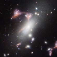 Gravitational lens distorting a galaxy cluster