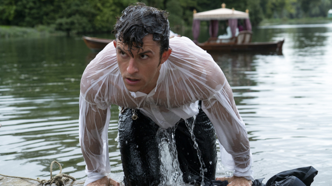 Jonathan Bailey as Anthony Bridgerton in episode 205 of "Bridgerton" coming out of a lake.