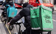 A delivery driver on a bike in London.